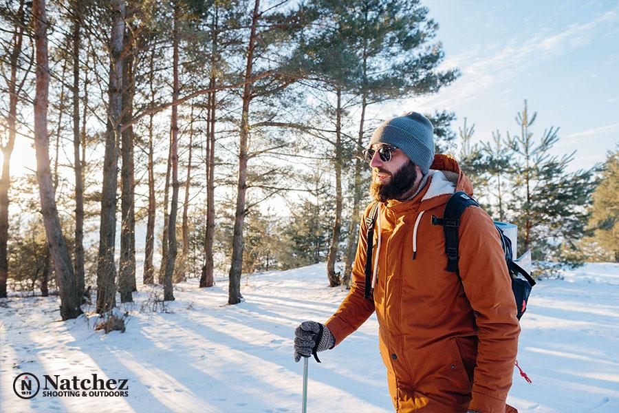 A man hiking in a winter forest?