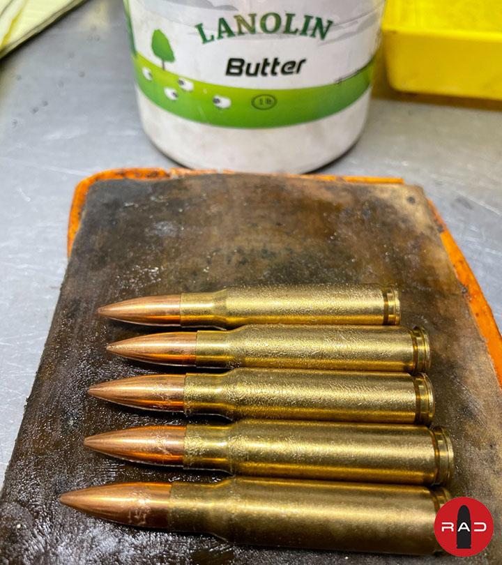 Hand-loaded ammunition with lubricant on table