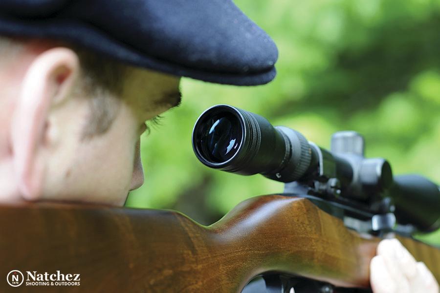 Rifle scope mounted on a hunting rifle