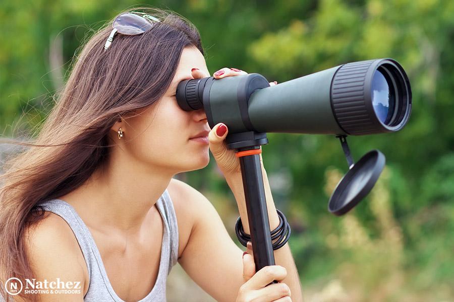 A woman observing nature through a spotting scope?