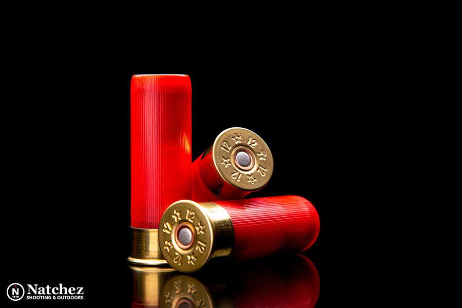 Red shotgun shells against a black background?